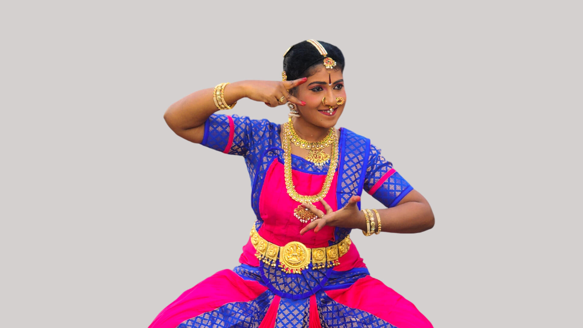 Dramatic stage moment capturing classical dance expression